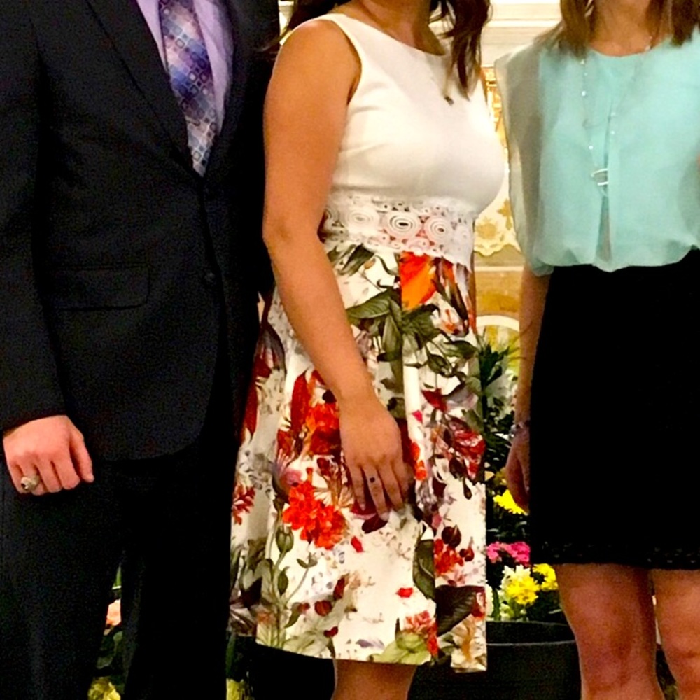 White and floral knee length dress